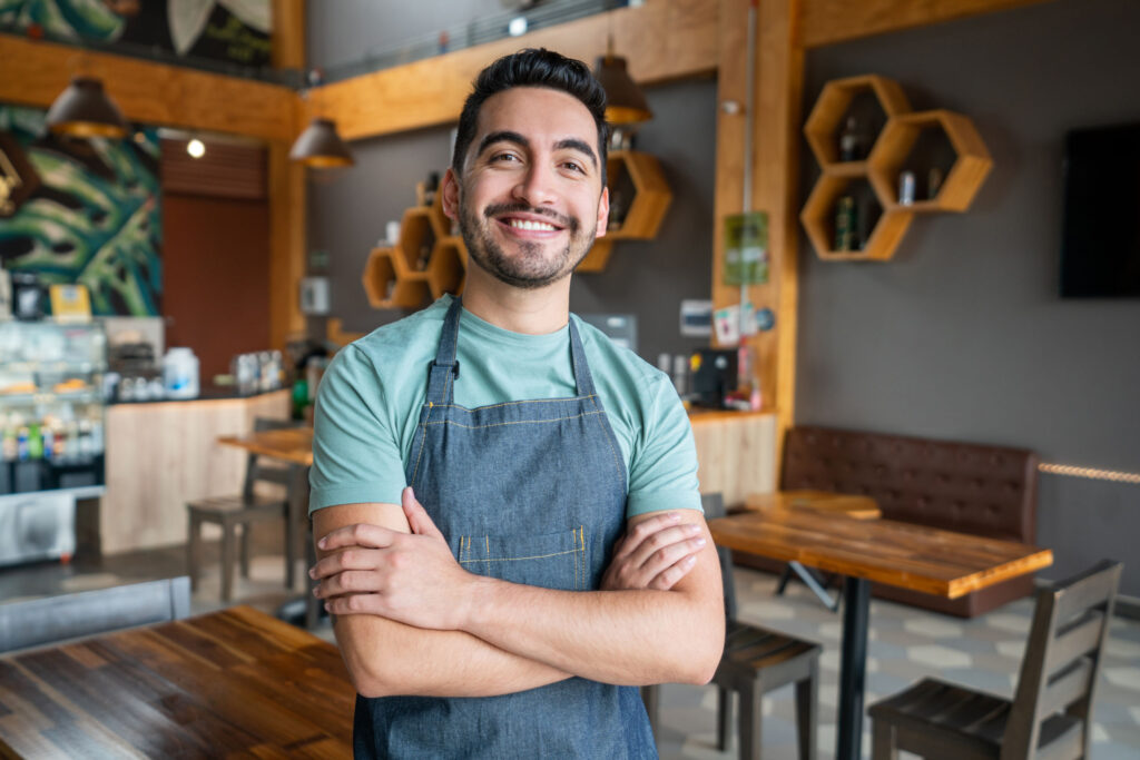 happy waiter working at a cafe